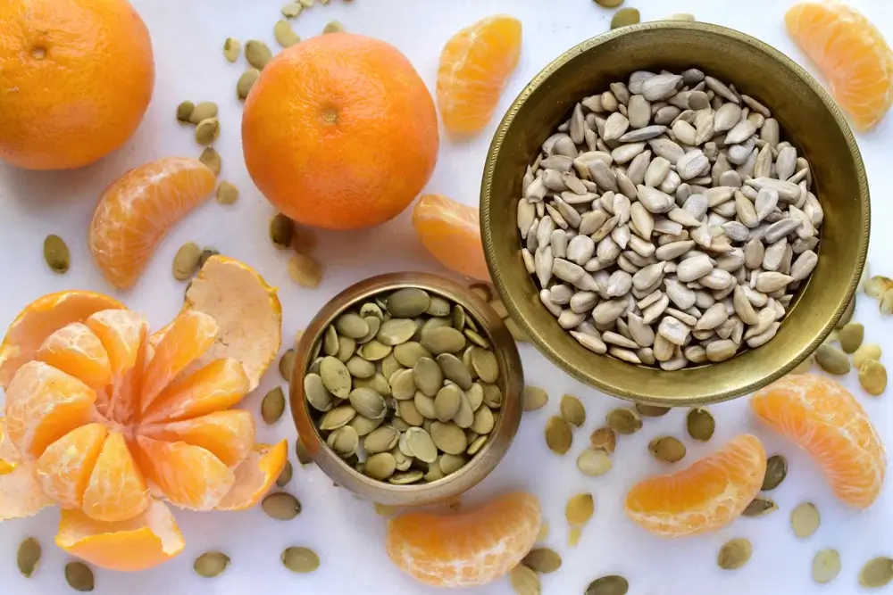Orange and a small handful of pumpkin seeds