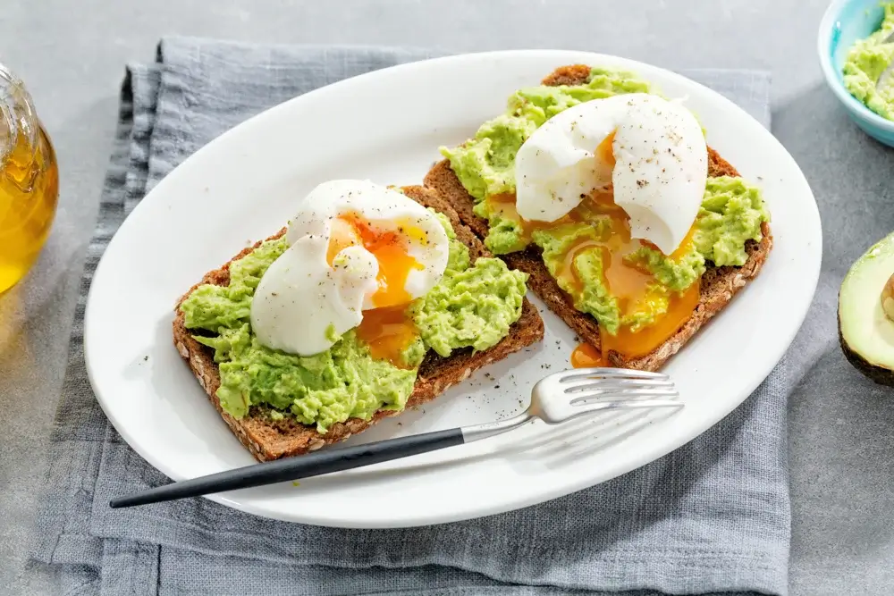 Whole-grain toast with mashed avocado and a poached egg