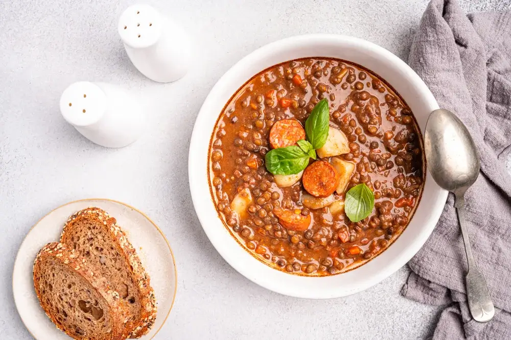 Hearty lentil soup with roasted vegetables and whole-grain toast