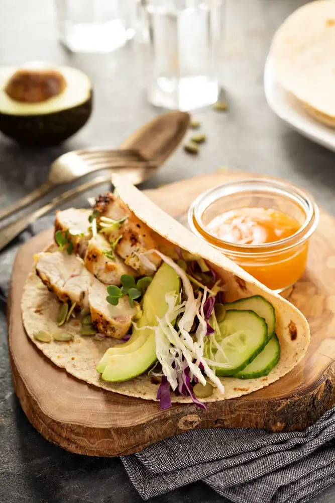 Turkey and avocado wrap on a whole-grain