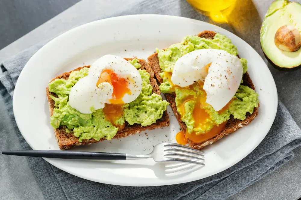 Whole-grain toast with avocado and a poached egg